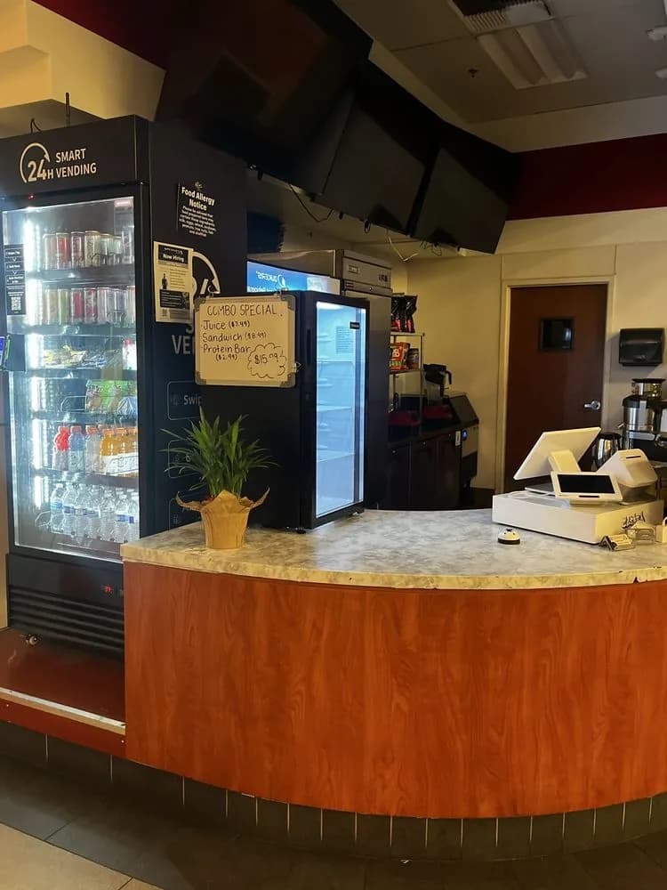 The MexiBites register with the combo special whiteboard: juice, sandwich and protein bar for $15.99